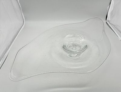 Large Glass Centerpiece
. Oval-shaped body, translucent glass with signs of handling, as seen in 