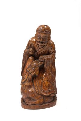 Santone in bamb&ugrave;. Alt. 23 cm ca. Scultura in bamb&ugrave; raffigurante "SANTONE". Cina. XIX secolo.