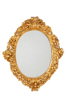 Specchiera in legno. 79x68 cm ca. Specchiera in legno finemente intagliato e dorato con putti ai 