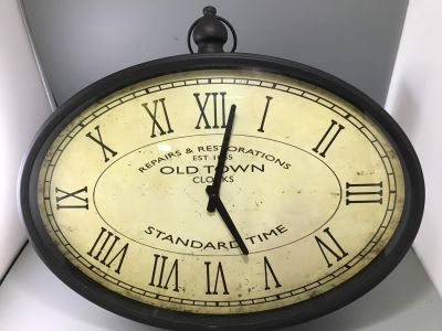 OVAL METAL 'OLD TOWN' WALL CLOCK 18 INCHES ACROSS W/O