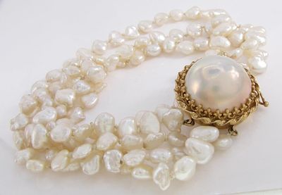 Freshwater Pearl Bracelet. A hand assembled 7" long four-strand Chinese freshwater pearl 