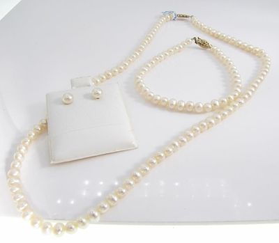 Jacmel Pearl Necklace, Bracelet, Studs, 10K. A suite of Jacmel pearl jewelry including a pair of 