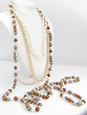 Three Pearl Necklaces. Three pearl necklaces including a 16" double strand freshwater pearl 