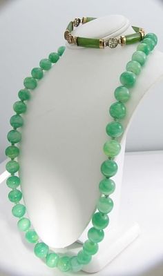 Jadeite/14k Bracelet, Jadeite Bead Necklace. Two items, including a jadeite 7" bar bracelet with 