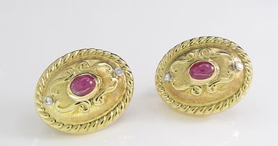18K Yellow Gold Ruby French Back Earrings. A pair of 18K yellow gold oval French back earrings 