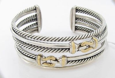 David Yurman Sterling, 18K Cable Buckle Bracelet. A sterling silver and 18K yellow gold, five 