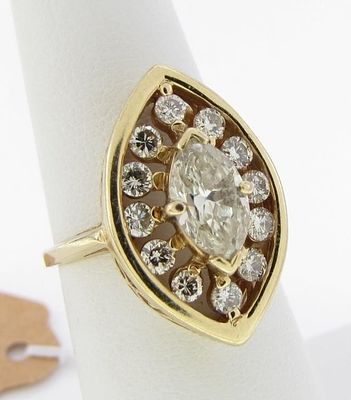14K Yellow Gold Diamond Ring. A 14K yellow gold (unmarked, tested) marquis shaped ring featuring 