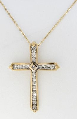 10K YG Diamond Cross with 14K YG Chain. A 10K yellow gold cross pendant containing eighteen 
