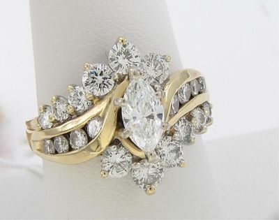 14K Yellow Gold Diamond Cluster Ring, ~1.65CT. A 14K yellow gold cluster design ring containing 