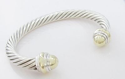 David Yurman 18K/Sterling Cuff Bracelet. A David Yurman sterling silver 7mm wide cable cuff 