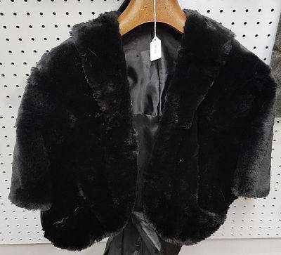 Sheared Fur Wrap/Cape. A sheared fur cape/wrap, satin lined, with slip in hand warmer pockets 