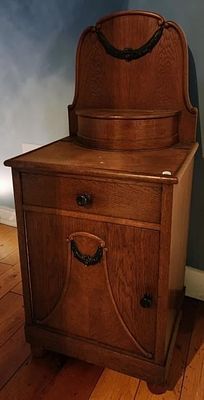 Vintage Wooden Nightstand. Vintage wooden nightstand, with swag decoration, having a lidded box 