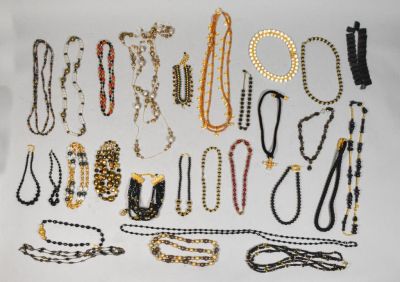 Collection of Black and Gold Tone Necklaces. Approximately 26 necklaces, predominately gold tone 