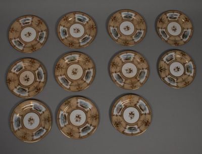 11 Porcelain Dessert Plates. 11 porcelain dessert plates with beige ground, gilt decoration with 