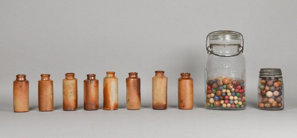 Lot 385: 2 Jars of Clay Marbles, 8 Pottery Bottles
