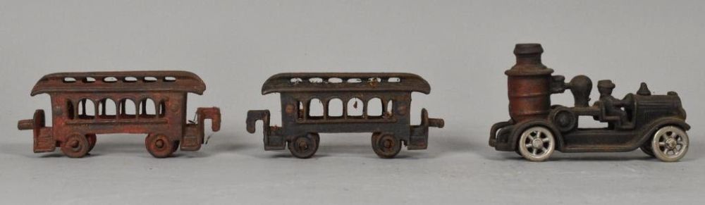 Lot 300: Cast Iron Fire Pumper and Train Cars