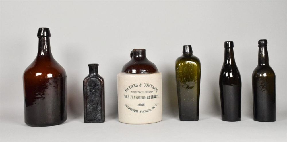 Lot 244: 6 American Brown Glass Bottles & Jug