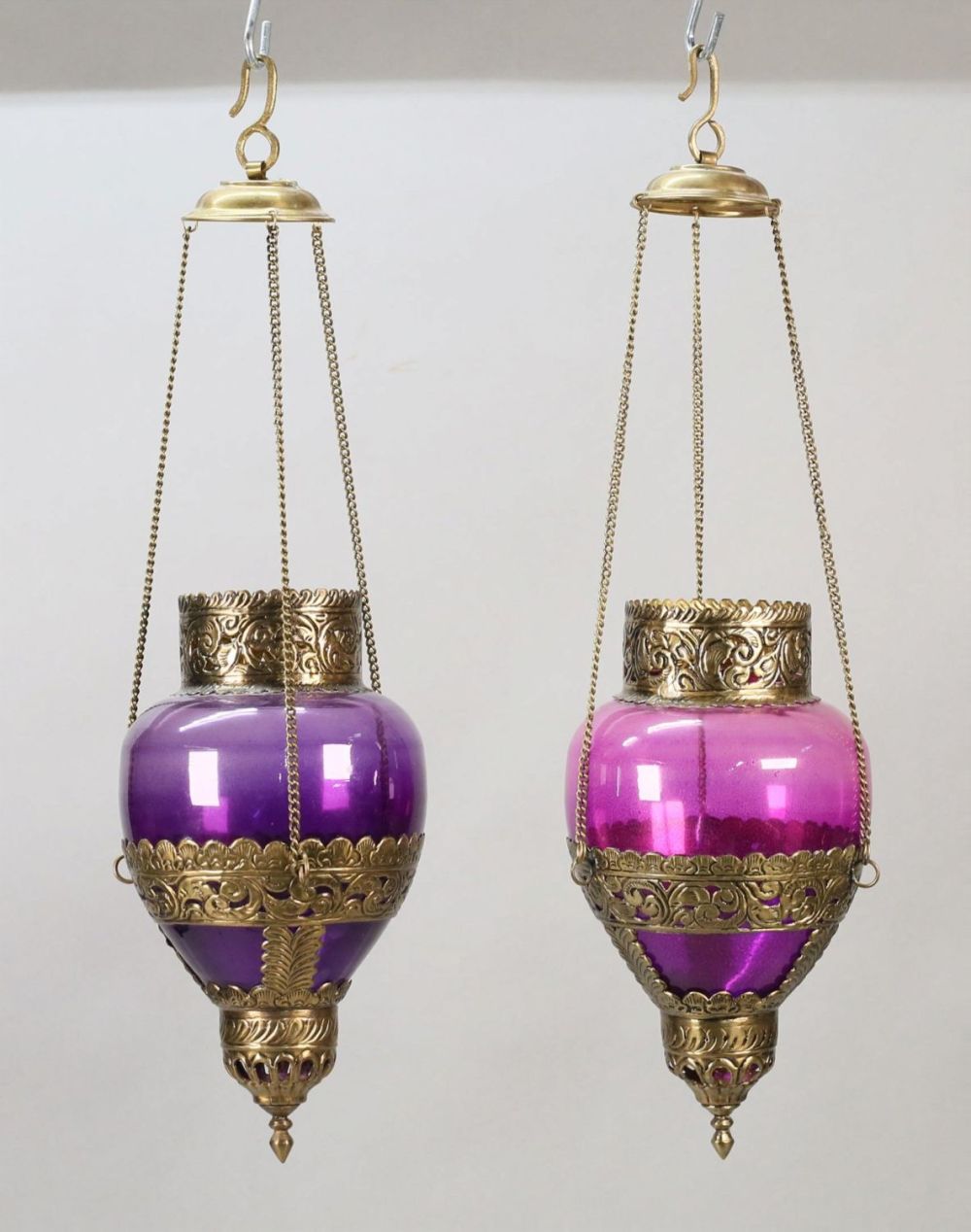 Lot 396: Pair of Amethyst Glass & Brass Hanging Fixtures