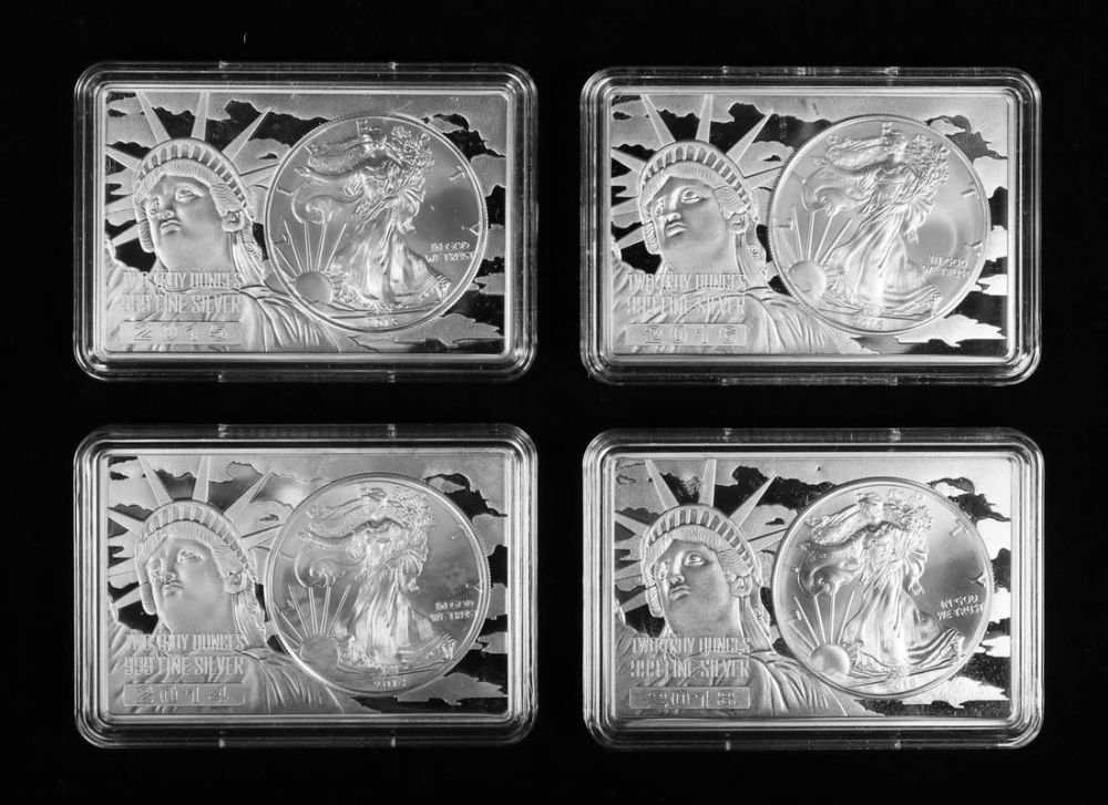 Lot 466: Silver Eagle Coins in 2 Oz Silver Bars