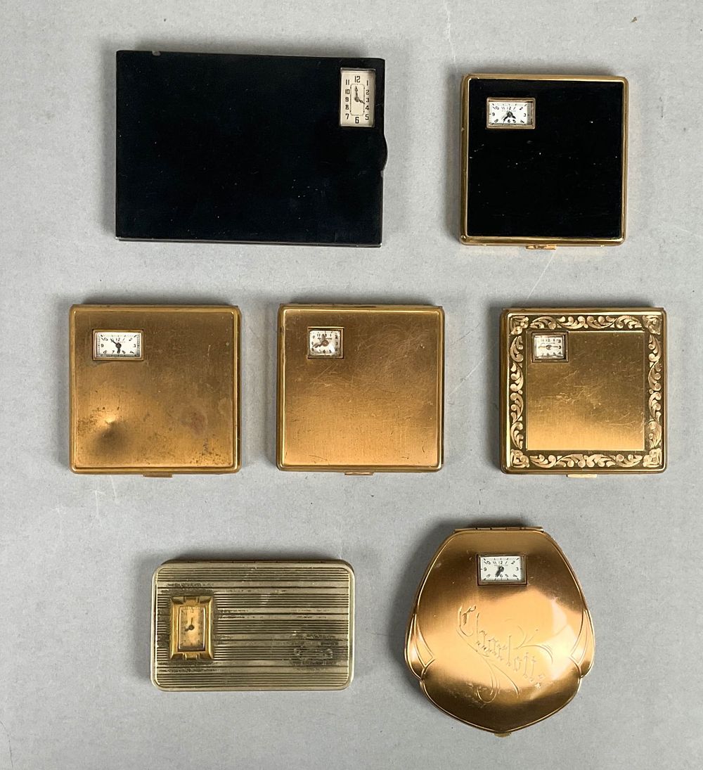 Lot 324: 7 Clock Compacts & Cigarette Case