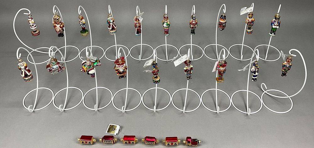Lot 257: 20 Radko Christmas Nutrackers & 1 Train Garland