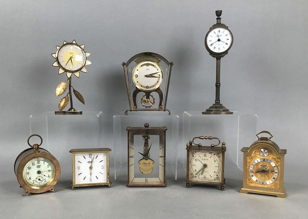 Lot 191: 8 Brass Table / Desk Clocks Swiza, Latama