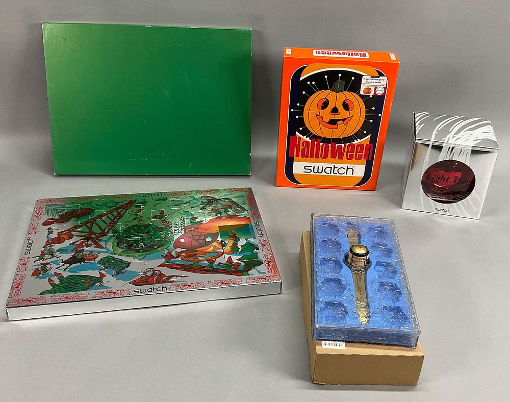Lot 347: 4 Swatch Holiday Watch Sets