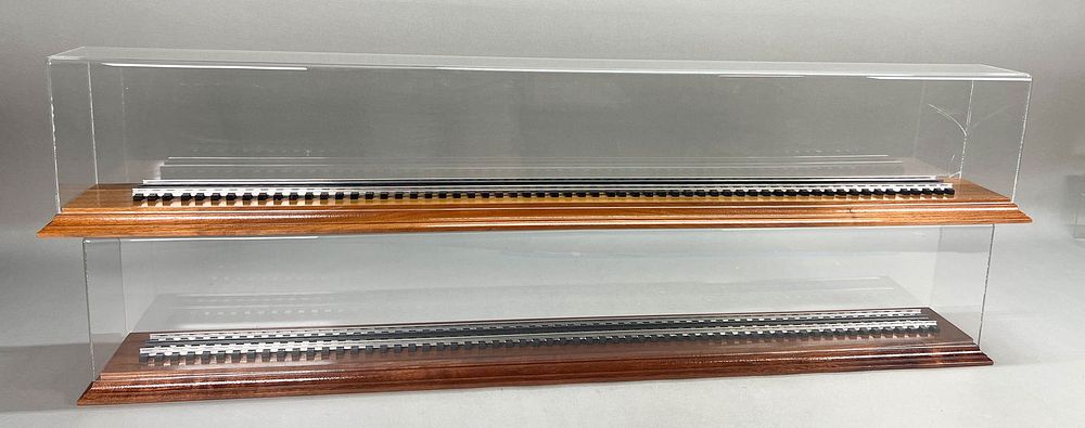 Lot 344: 2 Plastic Train Display Cases with Tracks