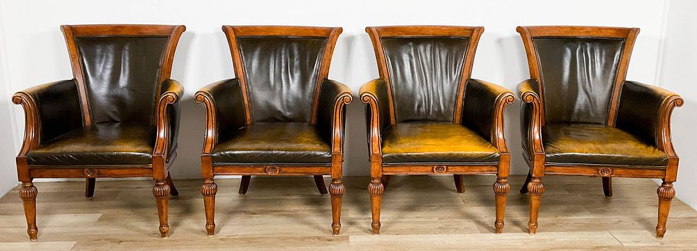 Four English Leather Library Chairs. Four English library or club chairs. Rubbing, nicks and 