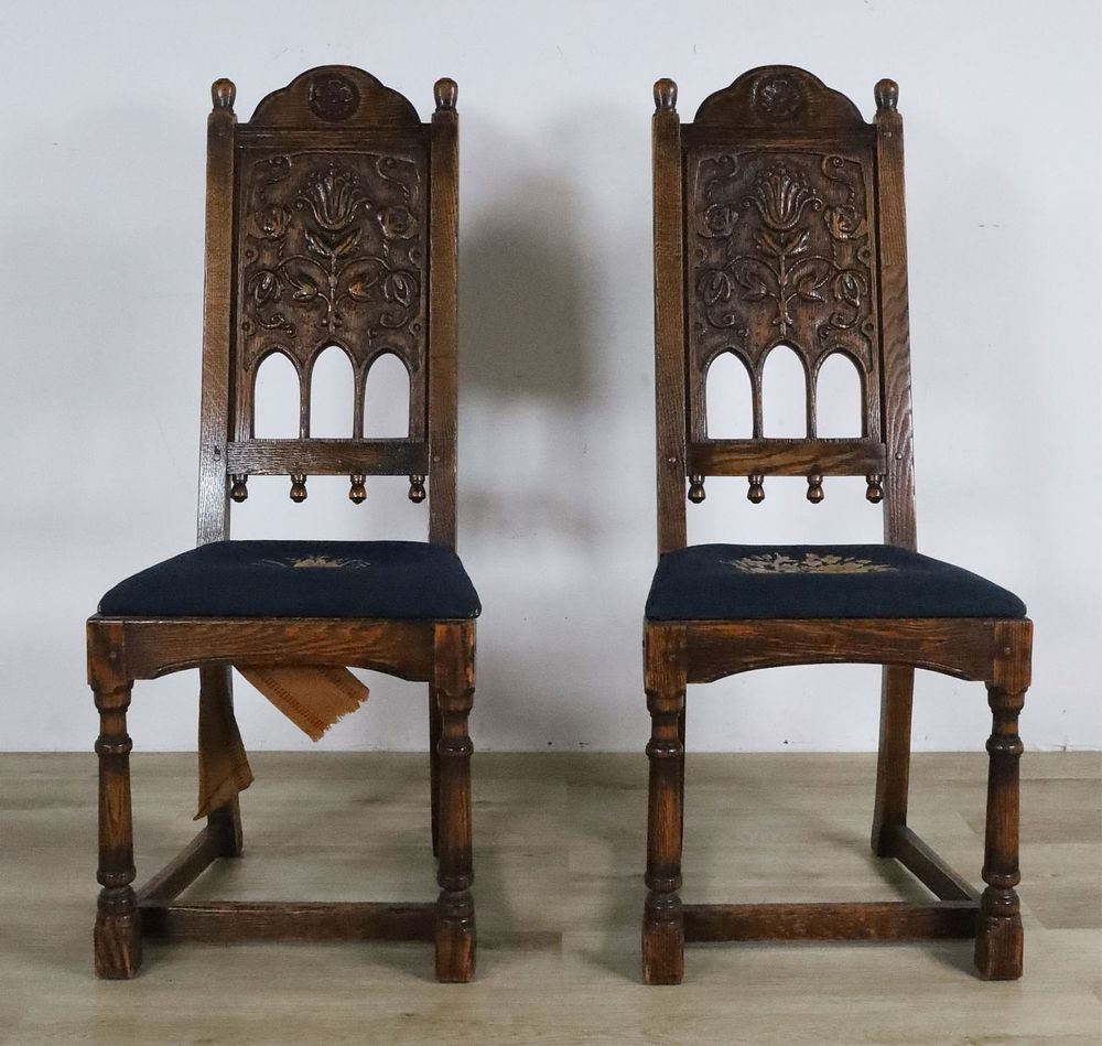 Pair of Renaissance Revival Chairs. Pair of carved Renaissance Revival side chairs. Needlepoint 
