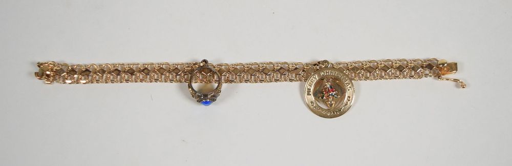 Lot 196: 14 Karat Gold Charm Bracelet With Sterling Ring