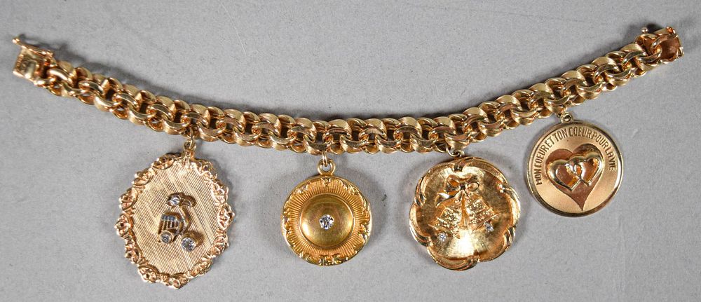 Lot 197: 14 Karat Gold Charm Bracelet