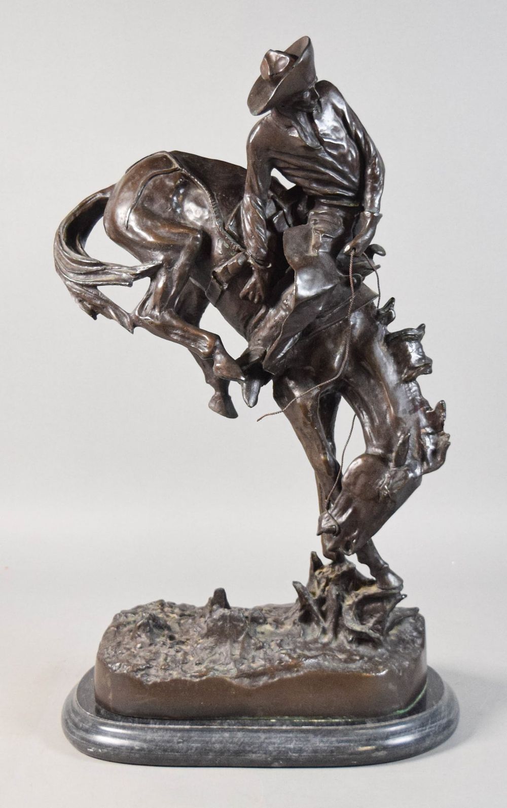 Lot 314: After Frederic Remington Bronze Bronco Buster