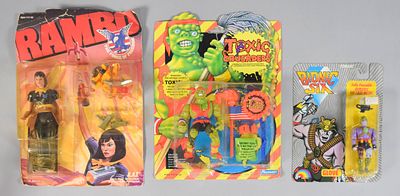 3 Vintage Action Features Incl Rambo, Toxic Crusaders, Bionic Six. Group of three factory-sealed 