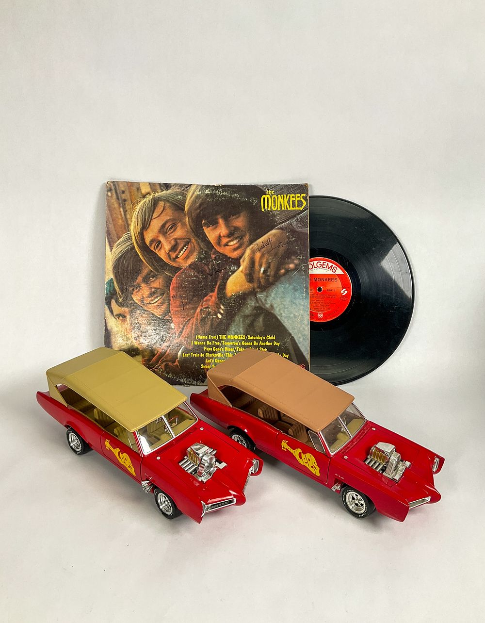 Lot 11: The Monkees Signed Record & 2 Ertl Monkee Mobiles