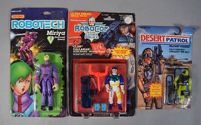 3 Vintage Robotech, RoboCop, and Desert Patrol Carded Action Figures. Group of three vintage 