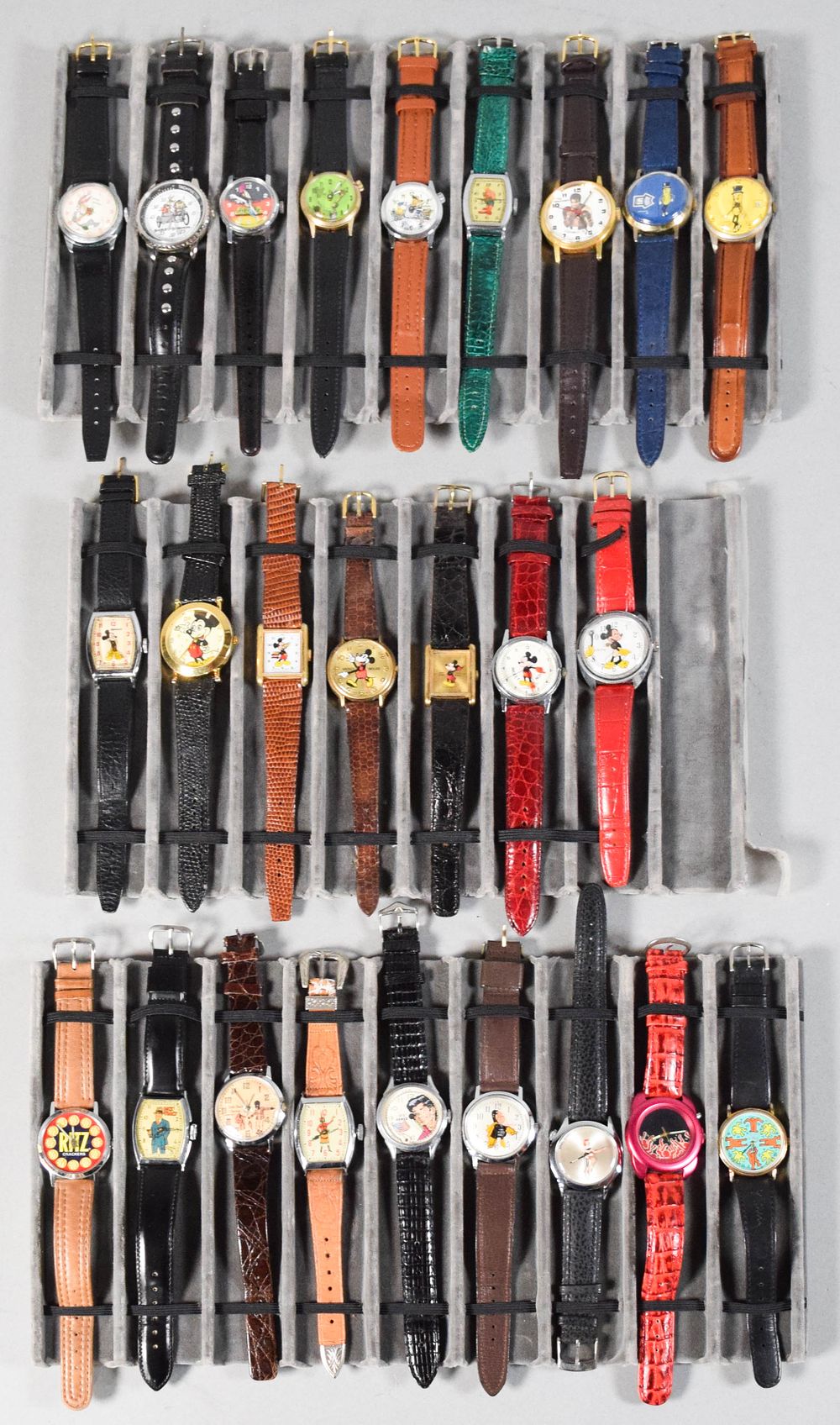 Lot 350: 25 Vintage Character, Advertising, and Novelty Wristwatches Incl Keith Haring