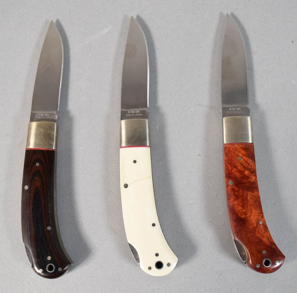 Lot 281: Group of 3 A.G. Russell ATS-34 Steel Folding Lockback Pocket Knives