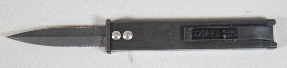 Lot 276: Tekna Manual Out-the-Front Sliding Pocket Knife