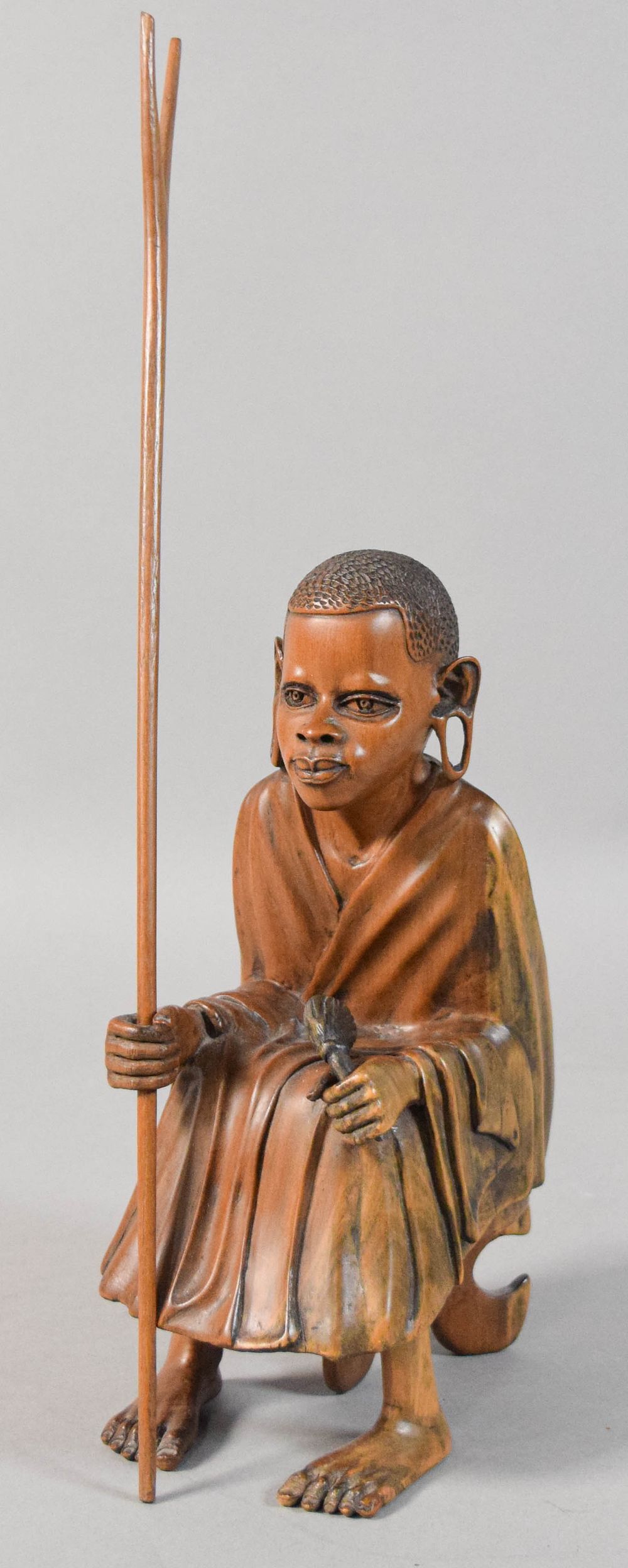 Lot 195: Carved Wood Seated East African Figure with Accessories