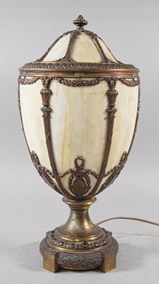 Neoclassical Style Slag Glass Urn Table Lamp. This table lamp is designed in an ornate 