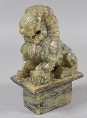 Chinese Carved Serpentine Stone Guardian Lioness Statue. A hand-carved serpentine stone Chinese 