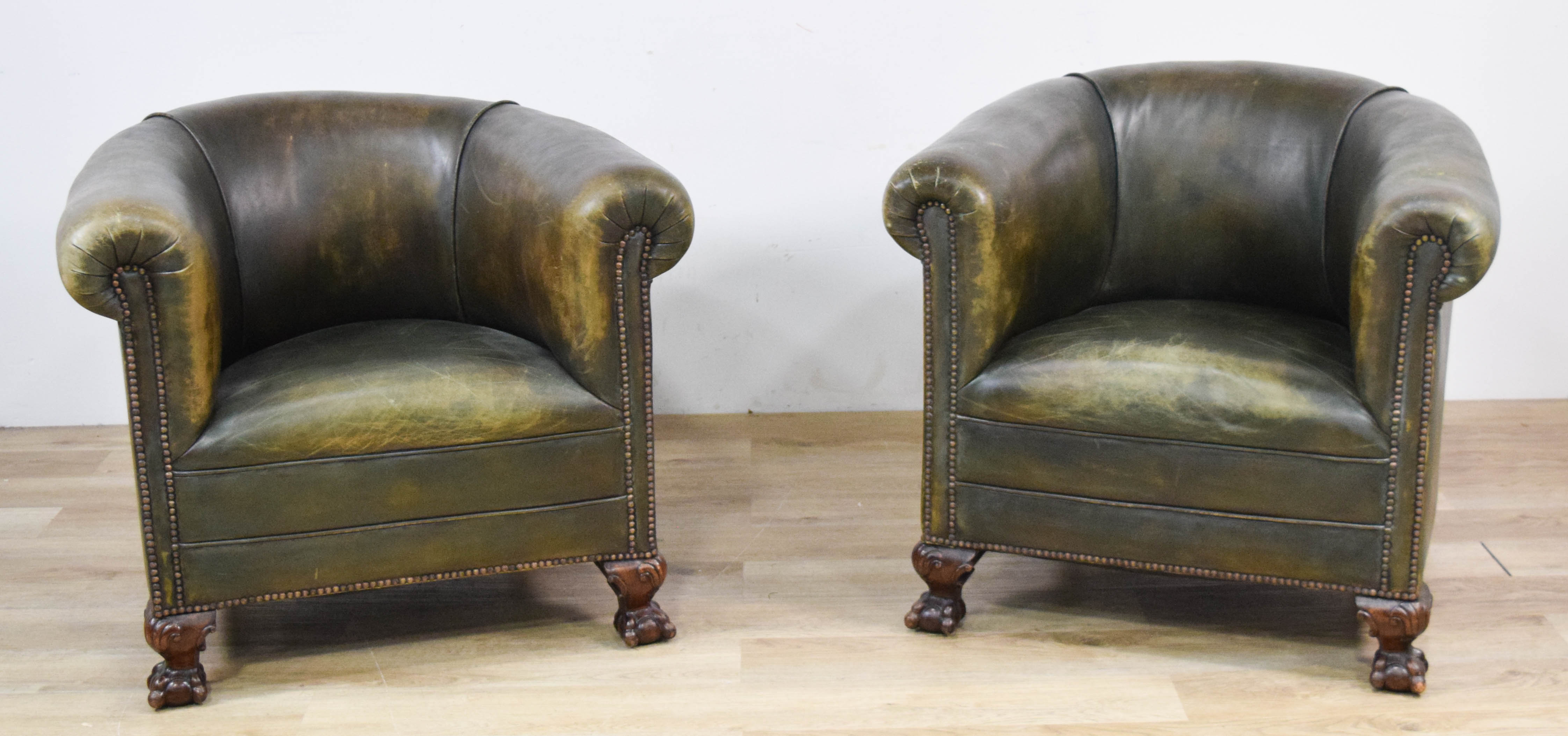 Pair of Green Leather Club Chairs with Ball and Claw Feet