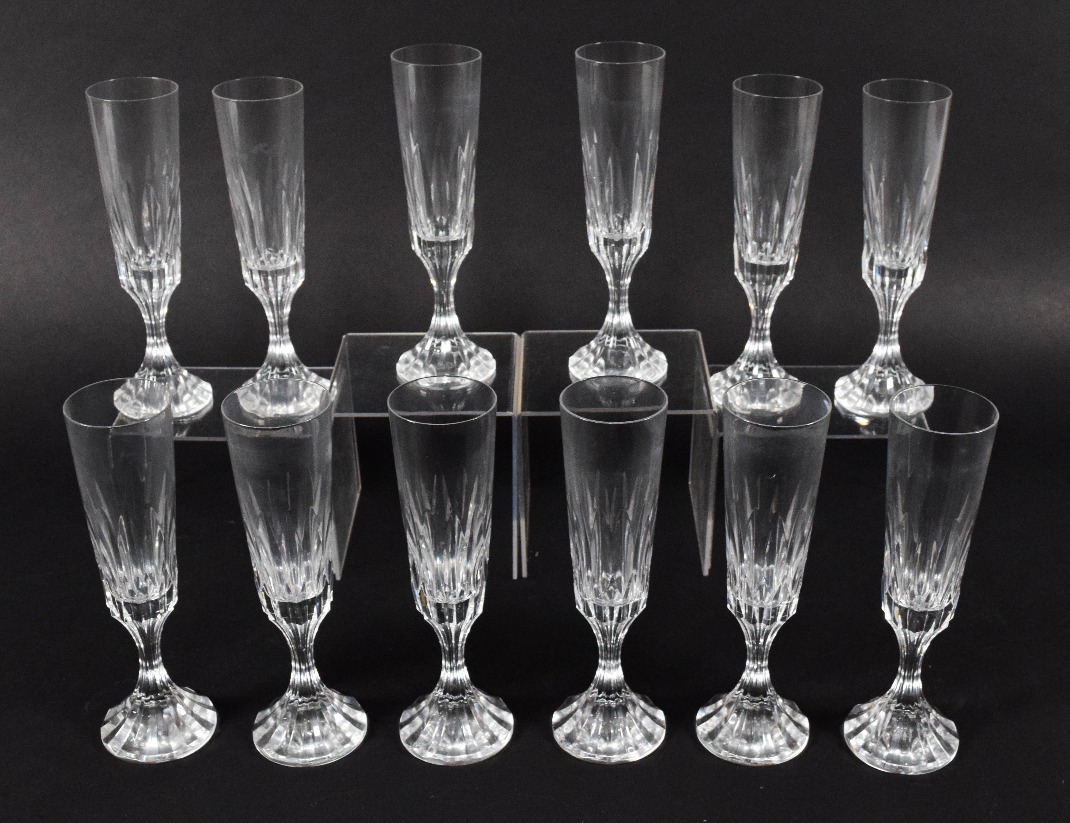 A Set of Twelve Baccarat D'Assas Pattern Crystal Champagne Flutes