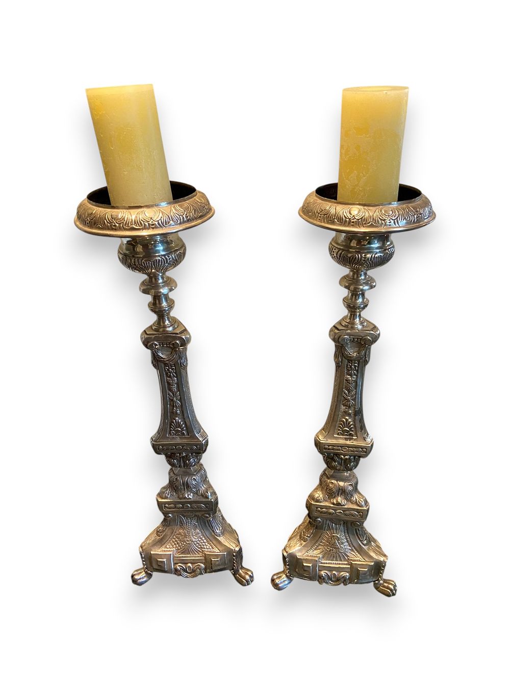 Lot 348: A Pair of Neoclassical Revival Style Patinated Metal Floor Candle Holders with Pillar Candles