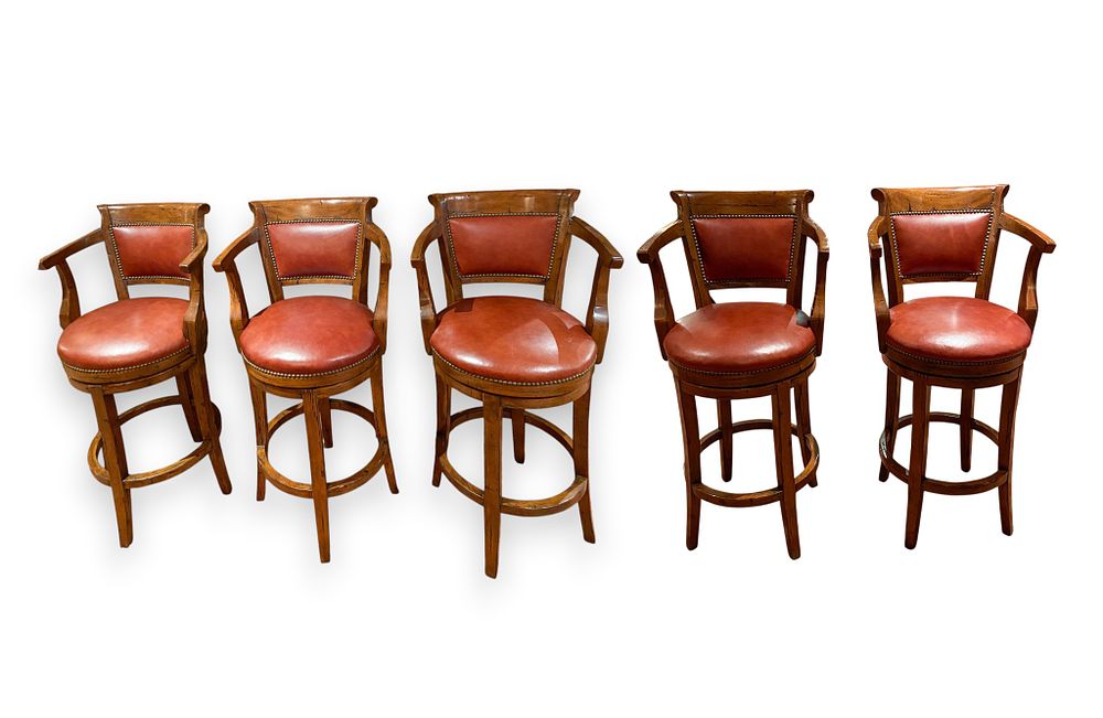 Lot 357: 5 Guy Chaddock and Co. Country English Distressed Pearwood and Leather Swivel Barstools