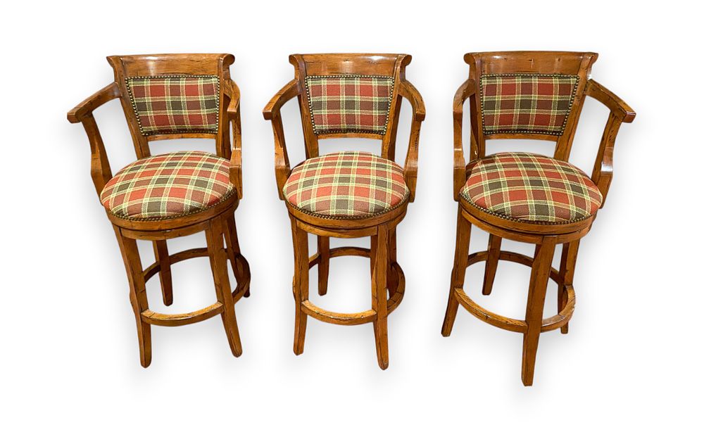 Lot 371: A Set of Three Guy Chaddock and Co. Country English Swivel Barstools