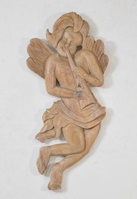 Hand-Carved Wood Wall Sculpture of a Cherub. Hand-carved wooden wall sculpture of a winged 