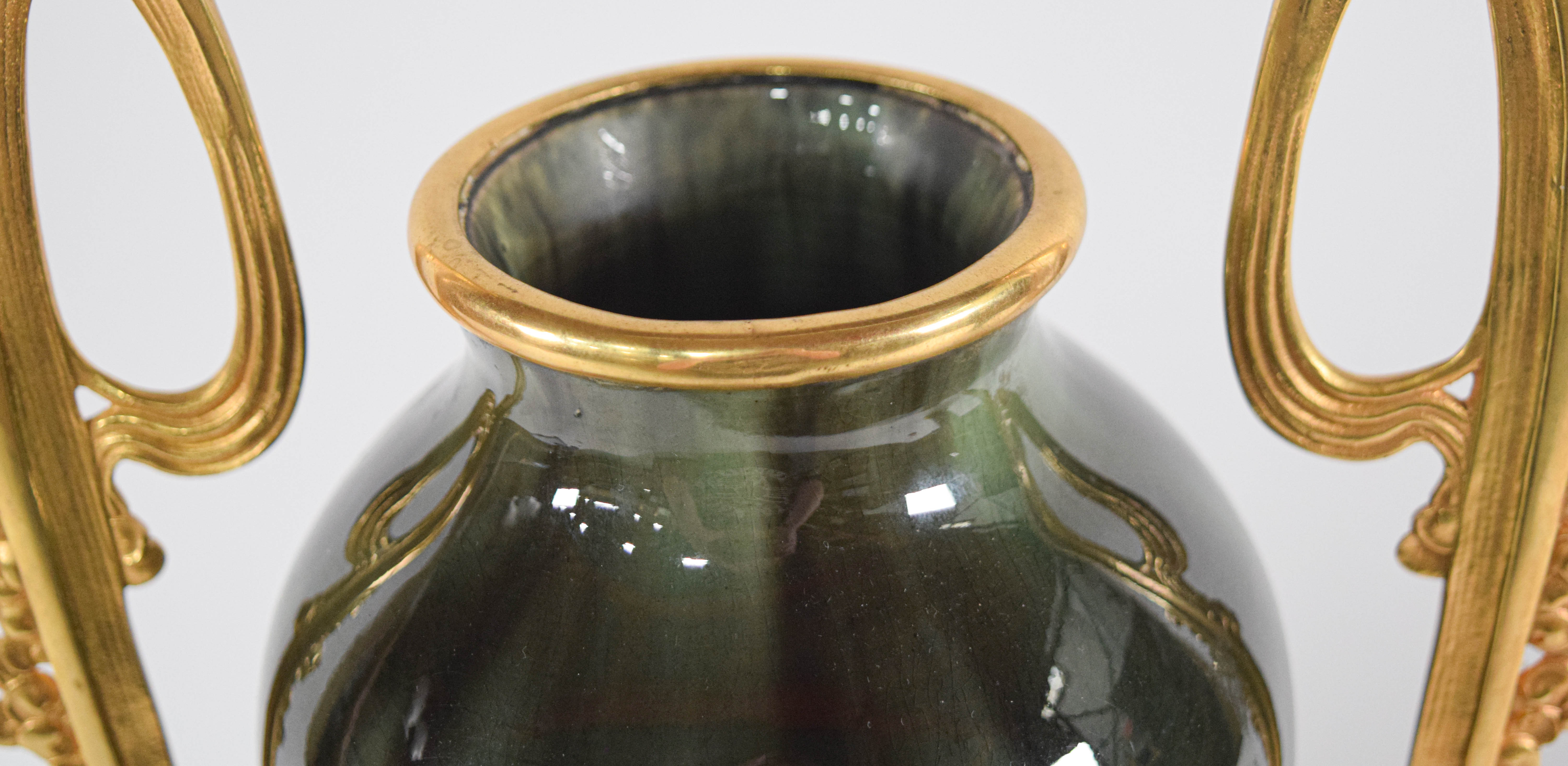 A Pair of Egyptian Revival Gilt Metal Mounted Glazed Ceramic Vases