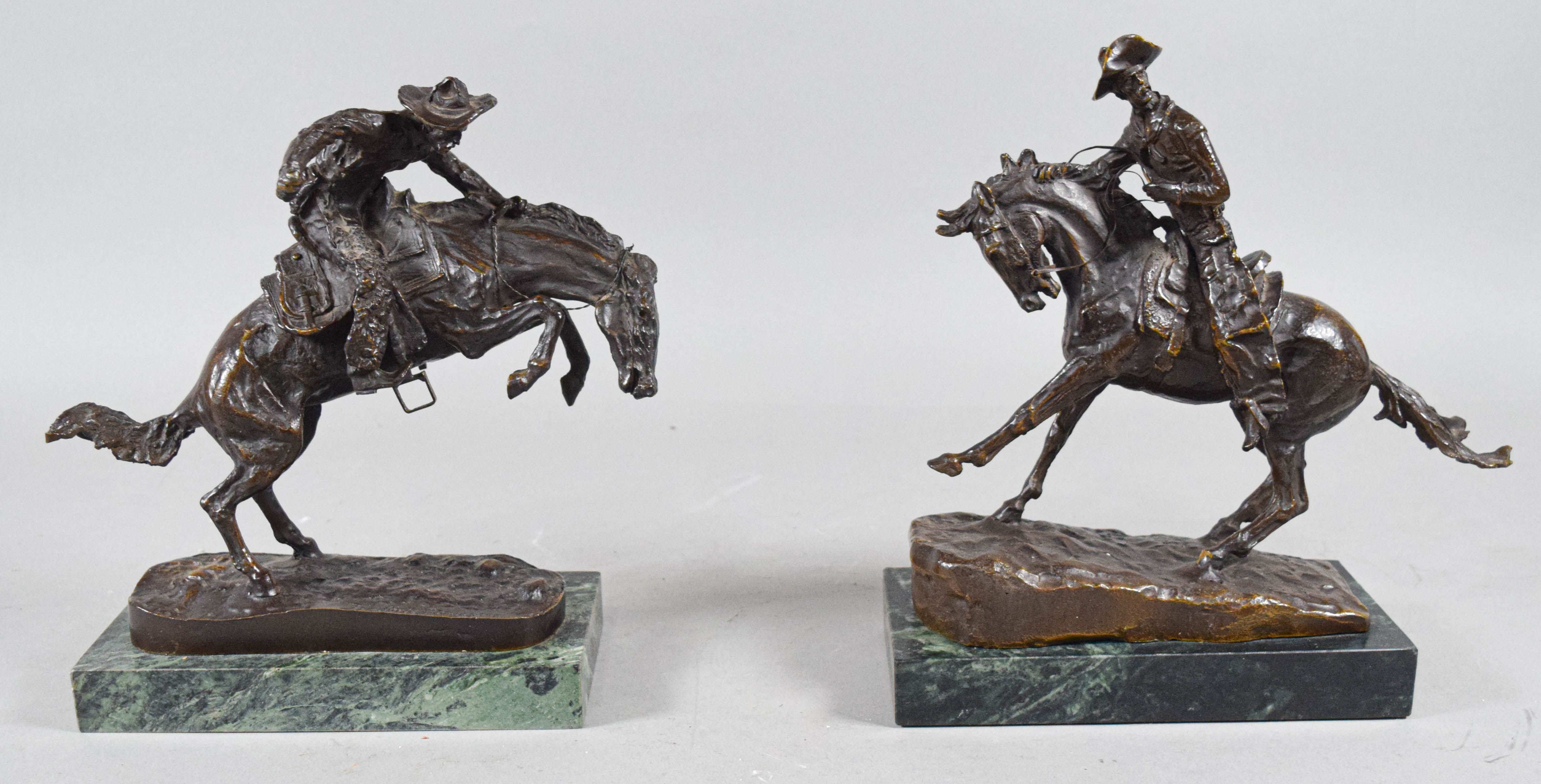 Pair of Frederic Remington Bronze Cowboy Sculptures